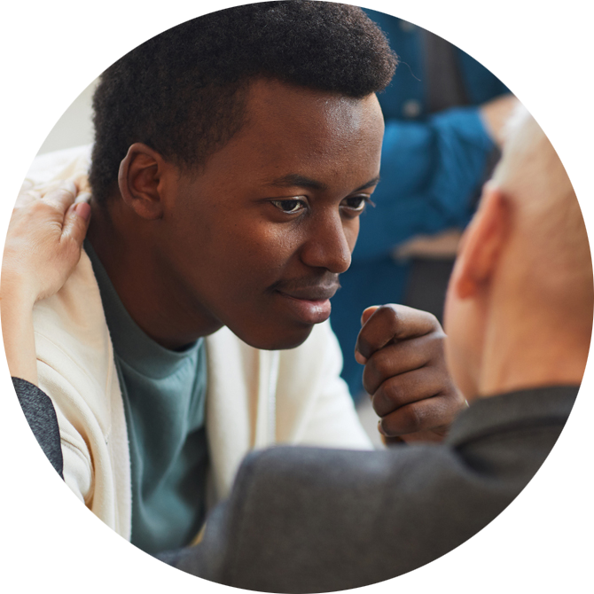 Young adult man receiving talk therapy