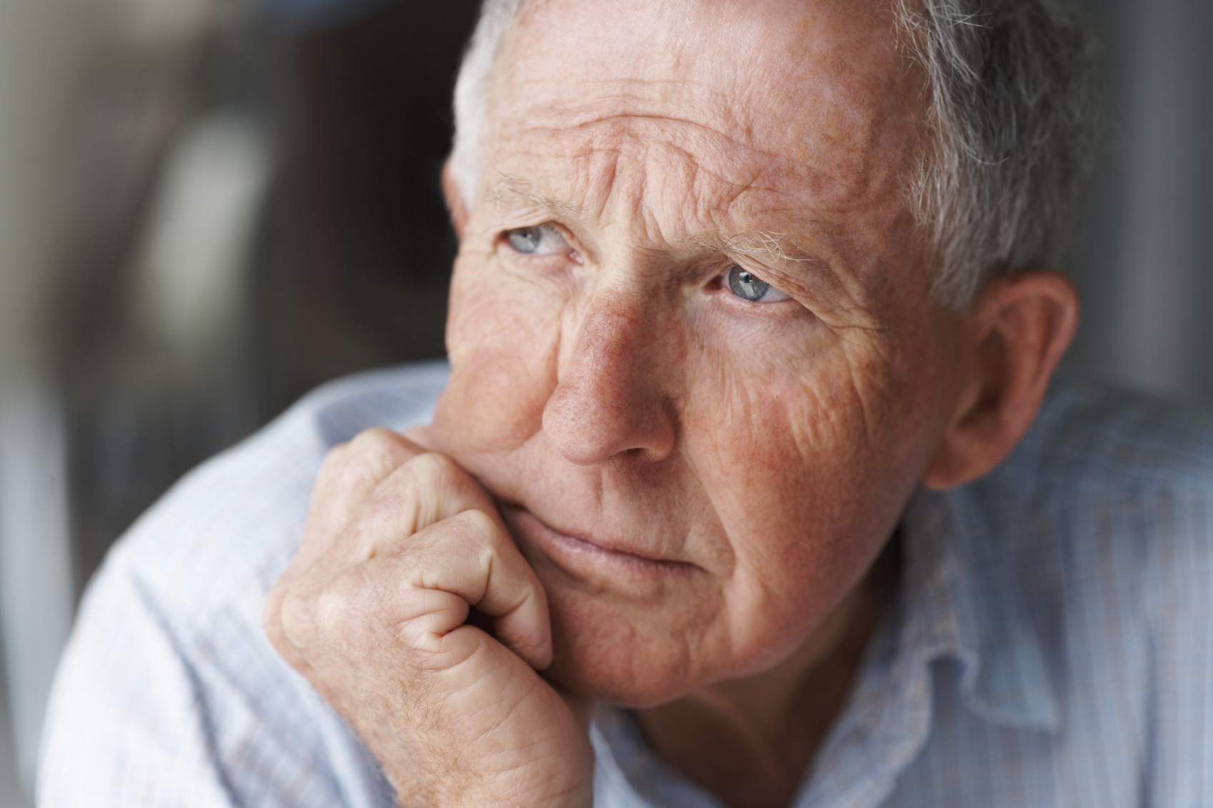 Elderly man in deep thought