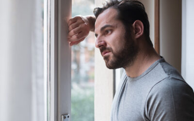 Man suffering and feeling alone at home